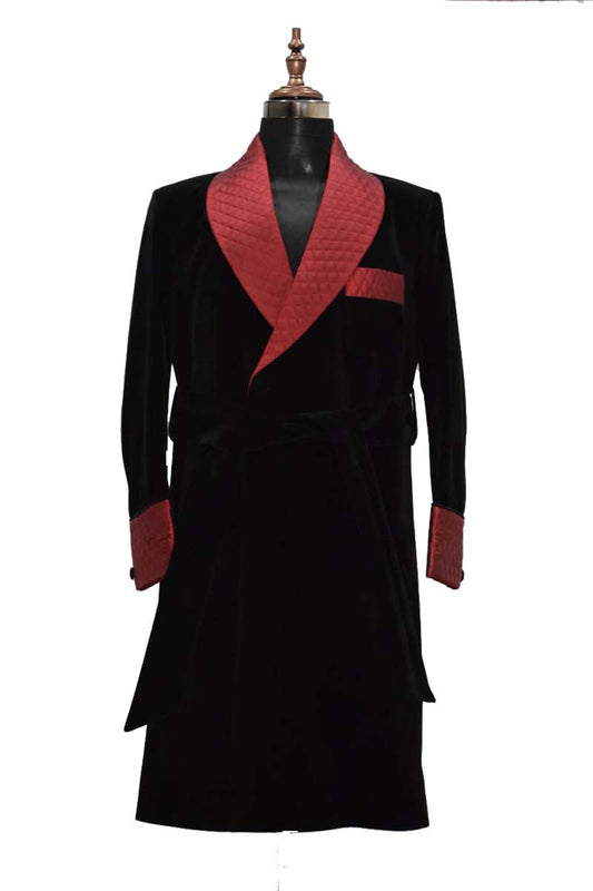 Men's black smoking jacket long coat with quilted lapel, cuffs, and belt in velvet.