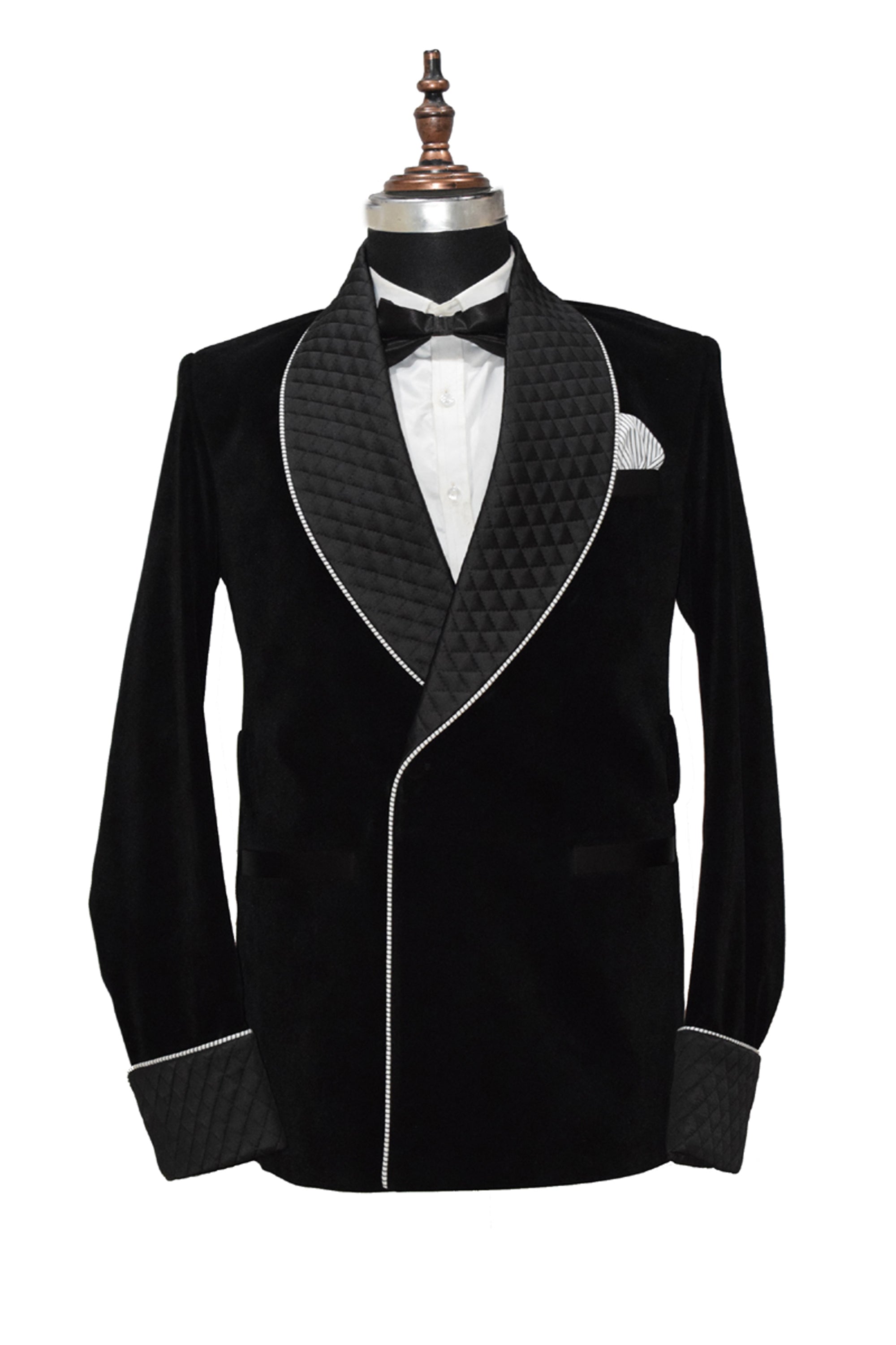 Men's black velvet smoking jacket with shawl collar and frog closure.