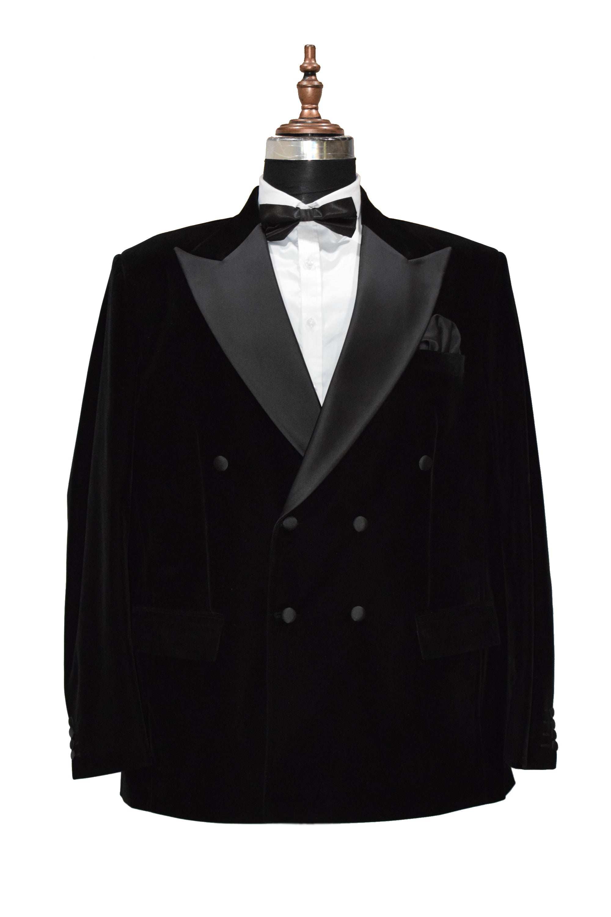 Black velvet smoking jacket with shawl collar and frog closure, perfect for formal occasions.