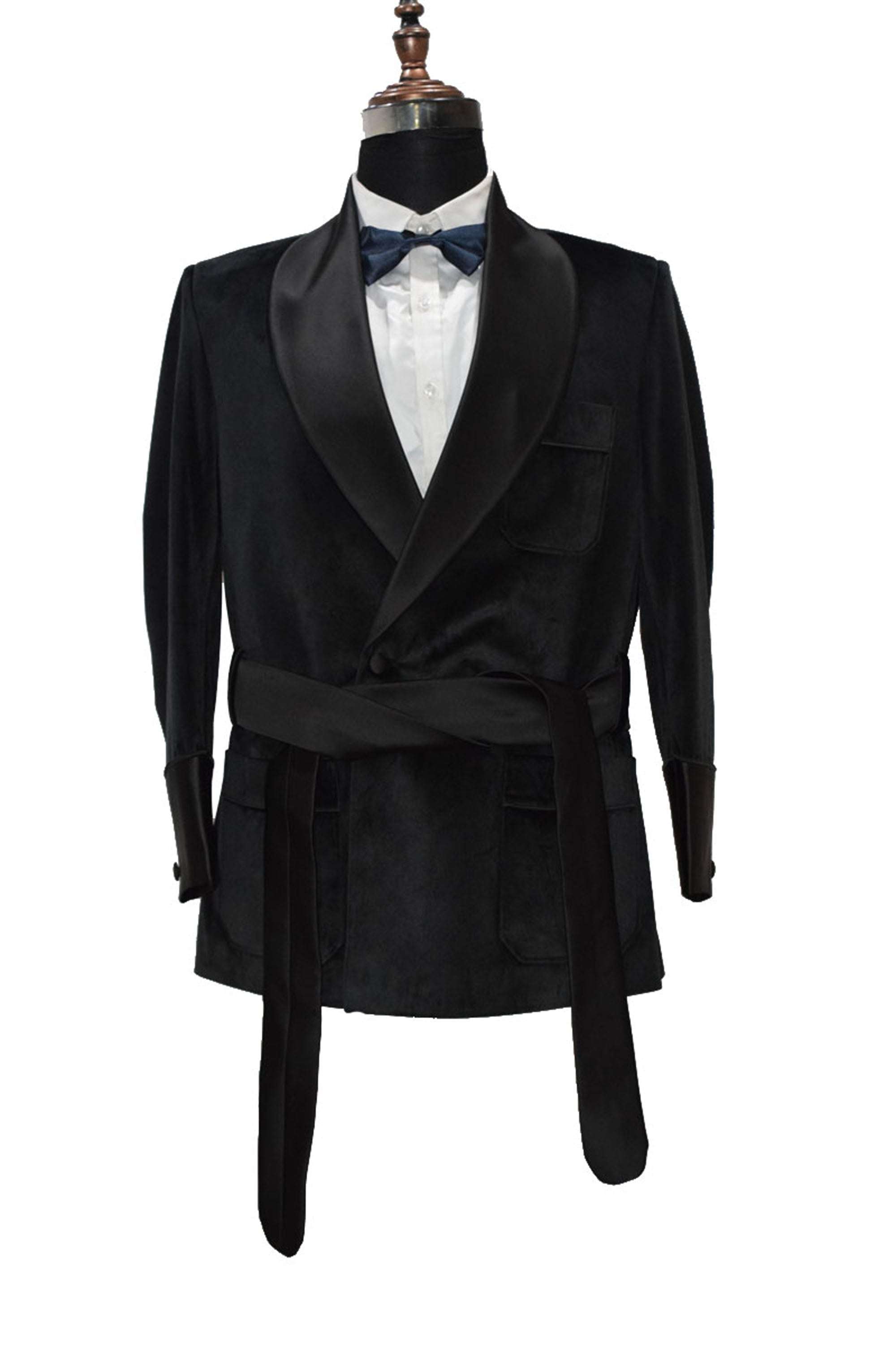 Men's black velvet smoking jacket with quilted lapels and belt, elegant evening wear.