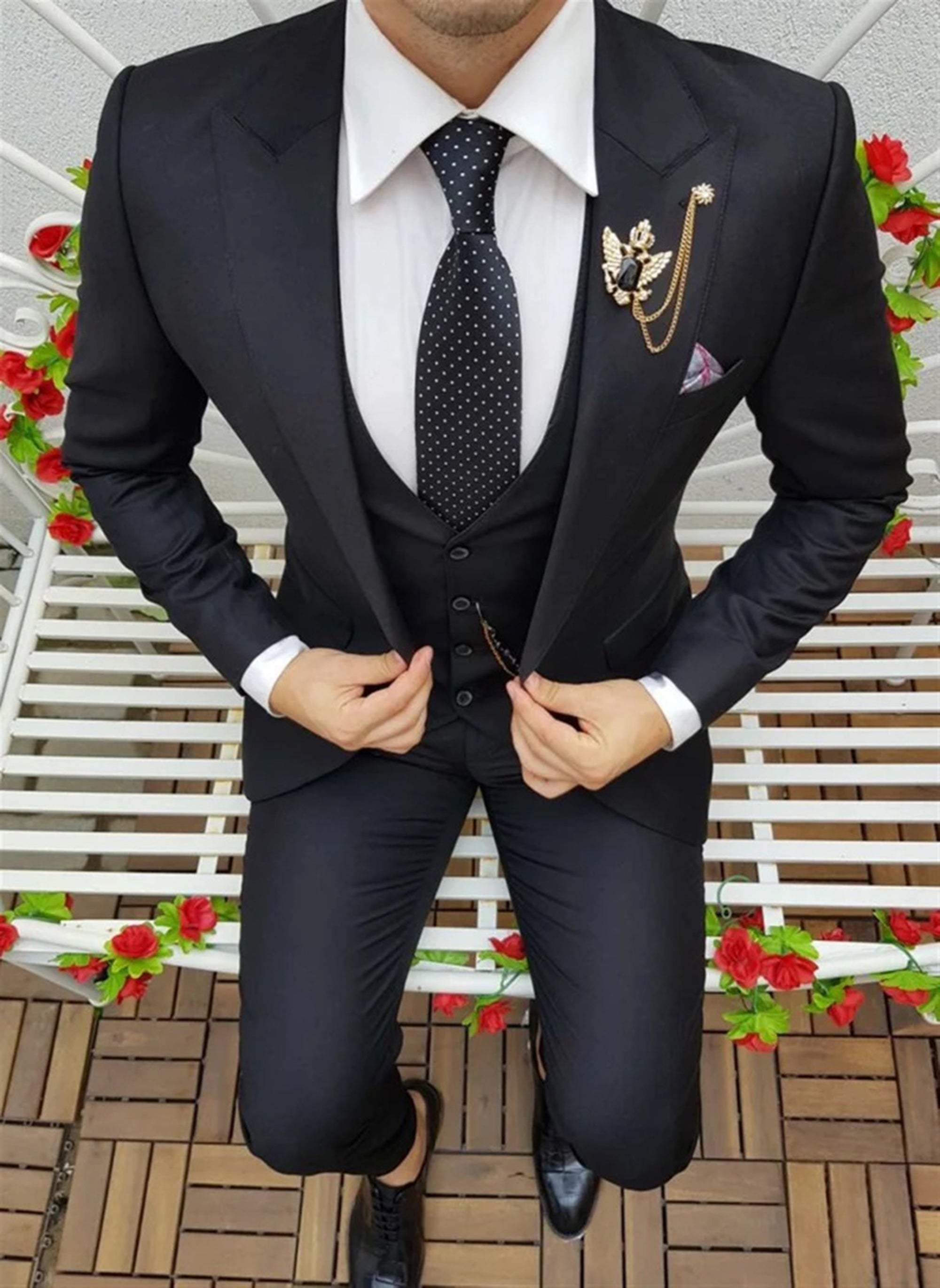 Men's elegant black three-piece suit with jacket, waistcoat, and trousers for formal events.