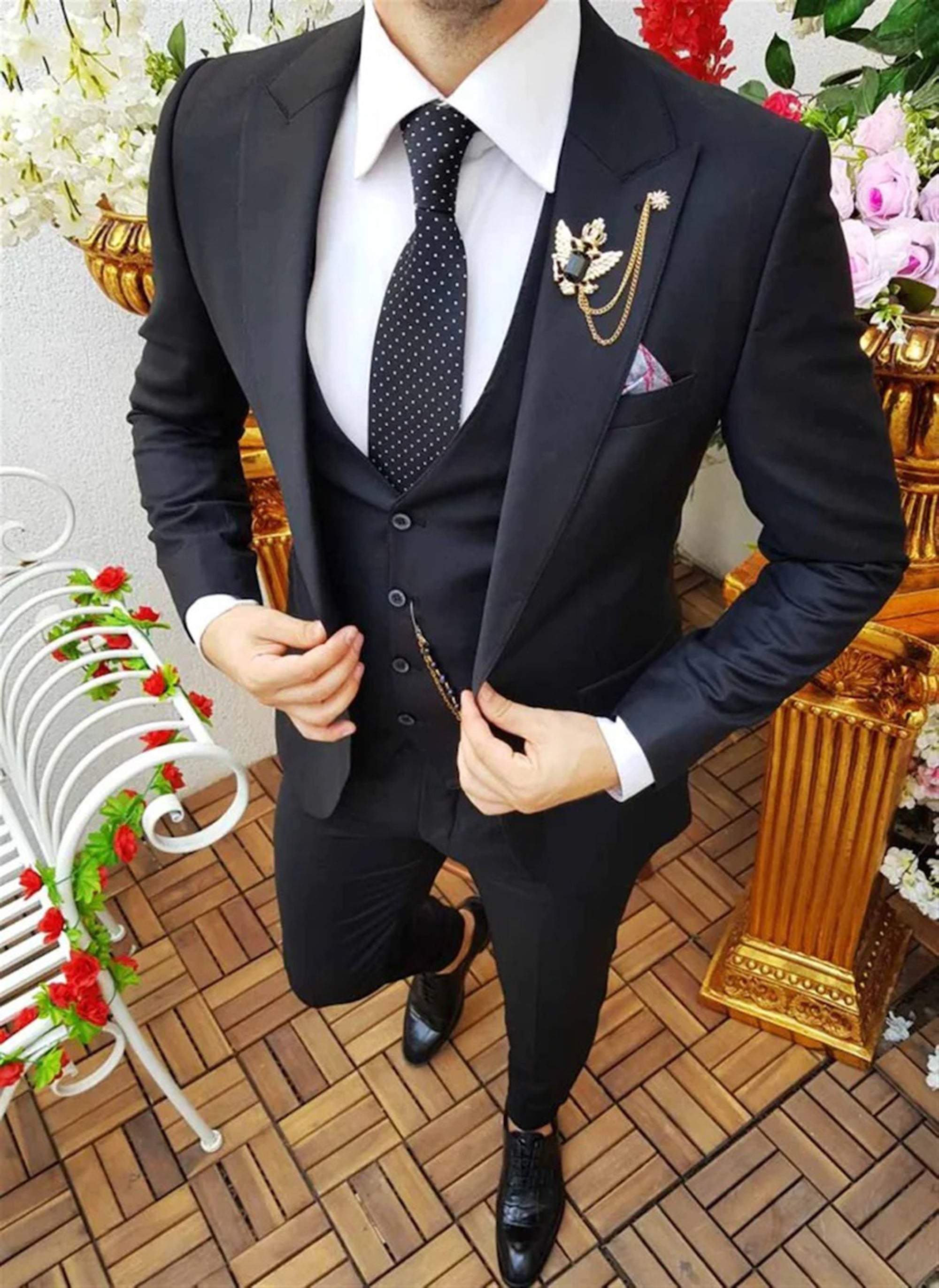 Men elegant black three-piece suit for business and formal occasions.