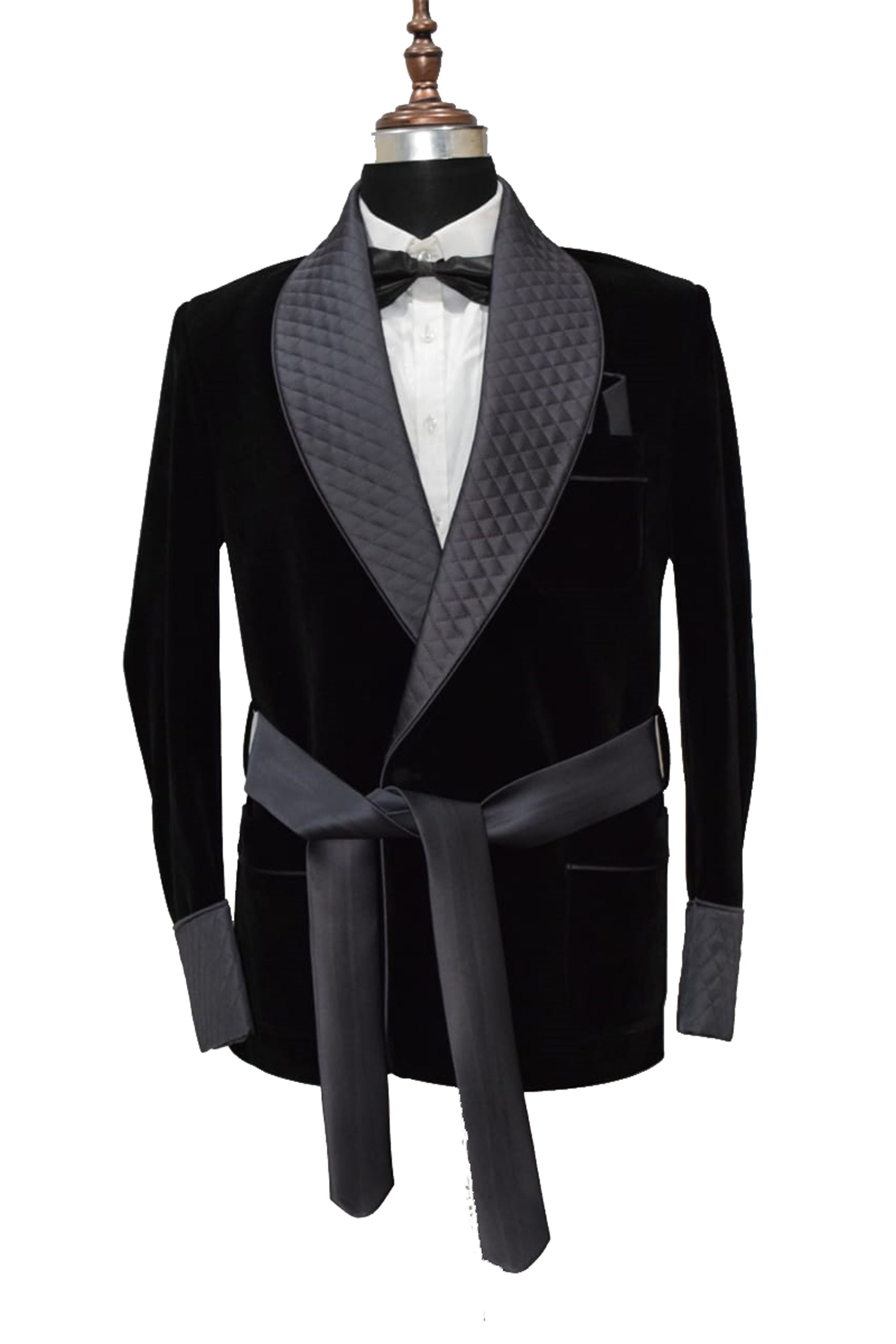 Men's black velvet smoking jacket with quilted lapel and satin belt.